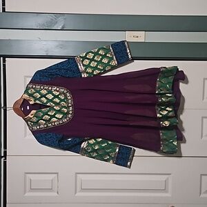 Beautiful ornate dress made in India, decorated beautifully with sequins.